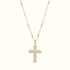 DUGO gold cross necklace featuring pave set zirconia stones on a delicate bar link chain