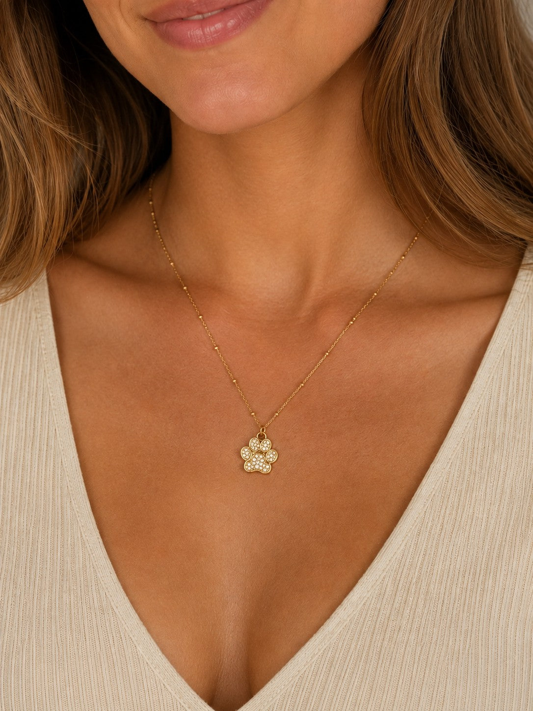 Woman wearing the DUGO gold Paw Pendant Necklace