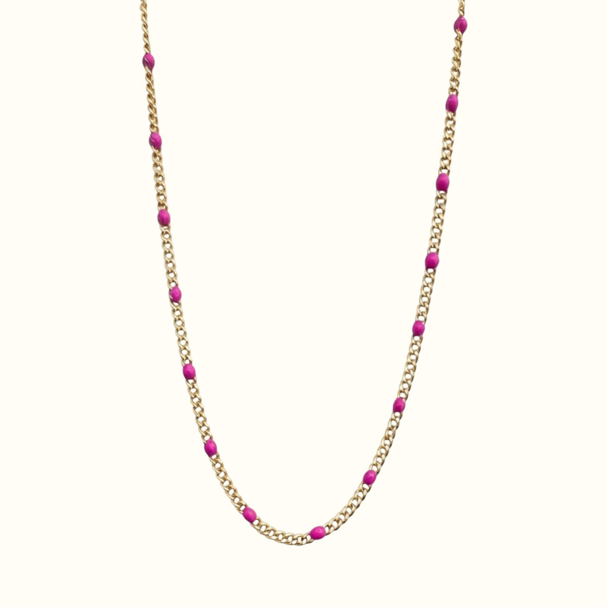 DUGO Curb Colors chain necklace featuring 18K gold-filled stainless steel links with vibrant pink enamel beads.