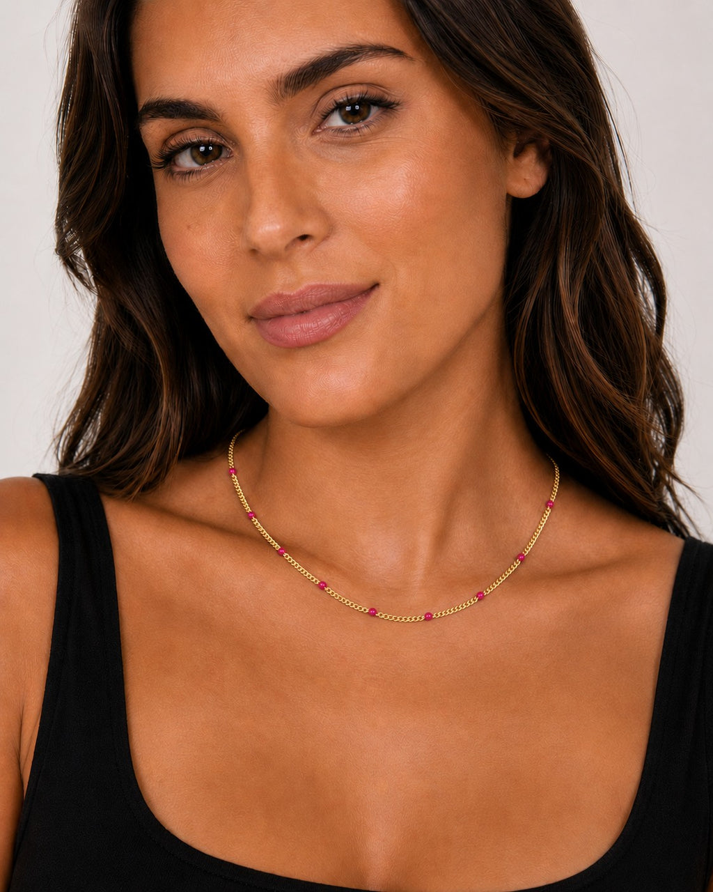 Close-up of the DUGO gold pink Enamel Curb Chain Necklace worn on the neck