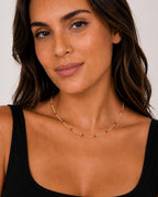 Close-up of the DUGO gold pink Enamel Curb Chain Necklace worn on the neck