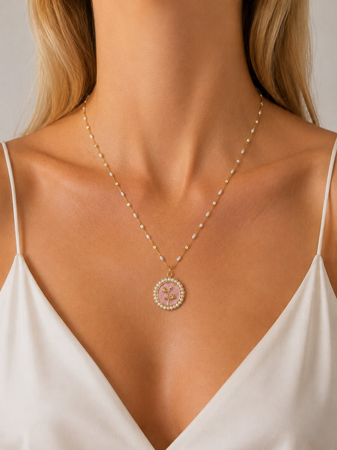 Woman wearing the DUGO gold Pink Floral Pearl Pendant Necklace