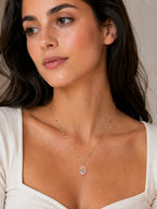 Close-up of the DUGO gold Pink Floral Pendant Necklace worn on the neck