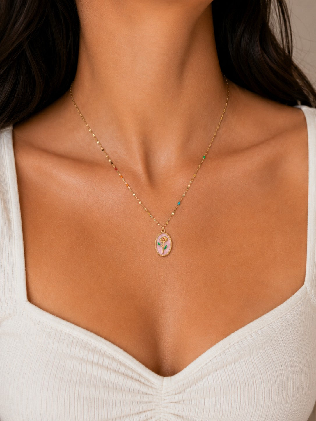 Woman wearing the DUGO gold Pink Floral Pendant Necklace