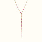 DUGO lariat necklace featuring a delicate gold chain with vibrant pink enamel bead accents in a Y-shape design.