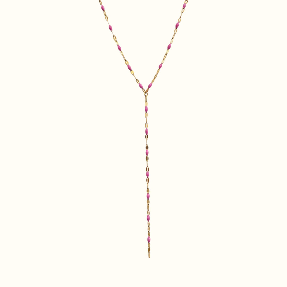 DUGO lariat necklace featuring a delicate gold chain with vibrant pink enamel bead accents in a Y-shape design.