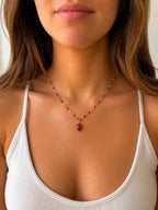Woman wearing the DUGO gold Red Enamel Strawberry Charm Necklace