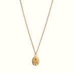 DUGO gold necklace featuring an oval pendant with an engraved rose flower design on a delicate chain