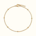 DUGO gold satellite curb chain bracelet with delicate polished beads and a lobster clasp closure.