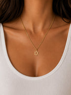 Woman wearing the DUGO gold Star David Classic Necklace