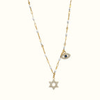 DUGO 18K gold filled necklace featuring a CZ paved Star of David pendant and a blue evil eye charm on a white link chain