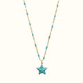 DUGO 18K gold-filled necklace featuring a blue enamel starfish pendant and matching turquoise bead chain accents.