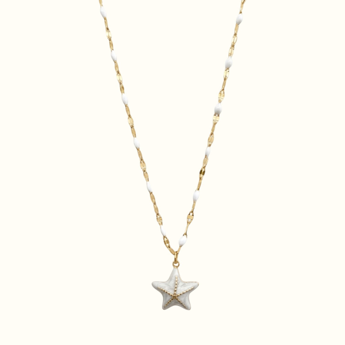 DUGO 18K gold-filled starfish pendant necklace with white enamel beads on a delicate chain for coastal style.