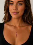 Woman wearing the DUGO gold five links necklace with pink stones on a delicate chain