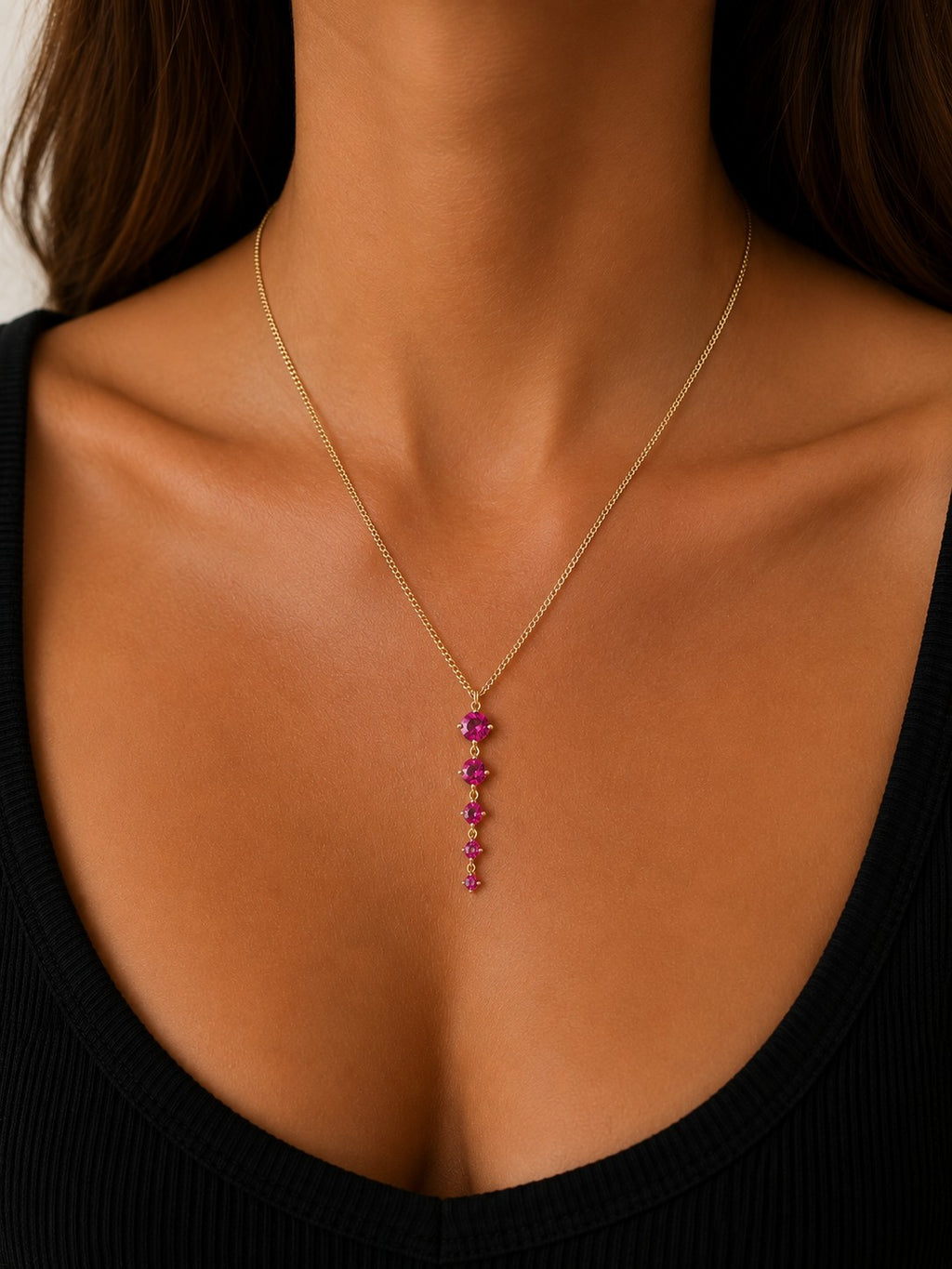 Woman wearing the DUGO gold tennis five links necklace with pink stones