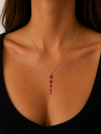 Woman wearing the DUGO gold tennis five links necklace with pink stones