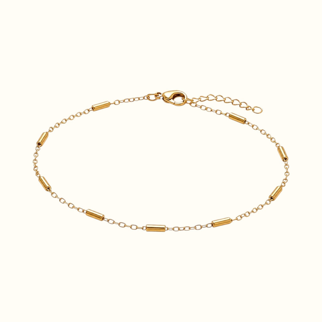 DUGO gold-filled tube station bracelet with polished stainless steel links and a lobster clasp closure.