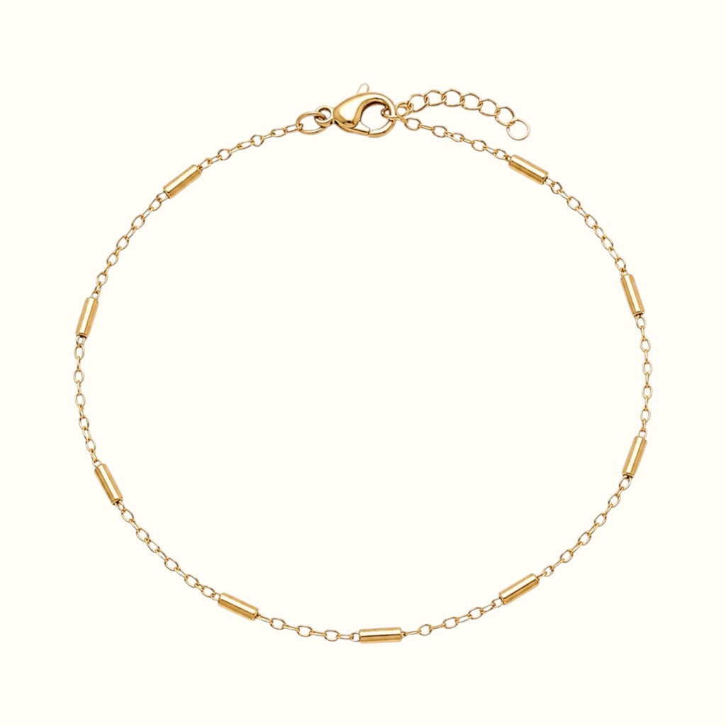DUGO 18K gold filled minimalist tube station bracelet with a delicate chain and lobster clasp closure.