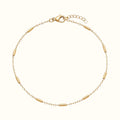 DUGO 18K gold filled minimalist tube station bracelet with a delicate chain and lobster clasp closure.