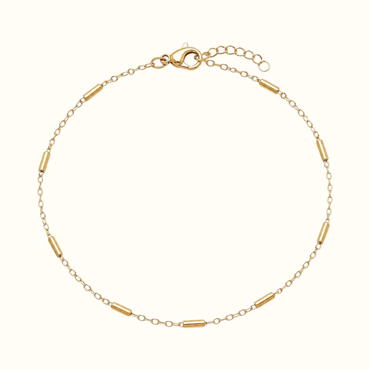 DUGO 18K gold filled minimalist tube station bracelet with a delicate chain and lobster clasp closure.