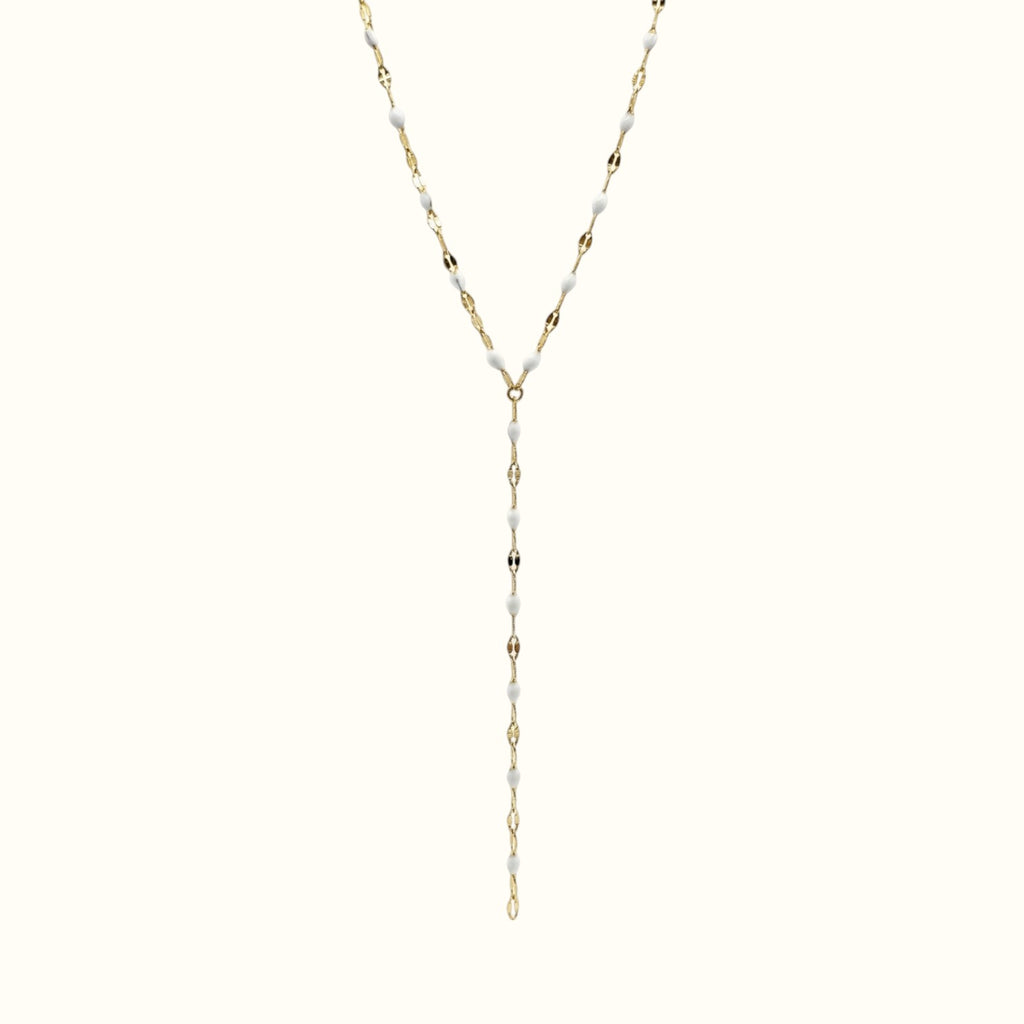 DUGO lariat necklace featuring a delicate gold chain with small white enamel lip-shaped accents in a Y-drop design.
