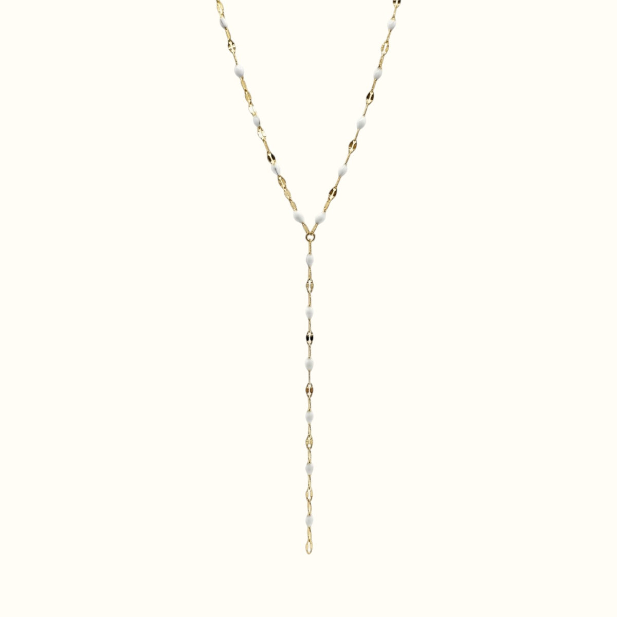 DUGO lariat necklace featuring a delicate gold chain with small white enamel lip-shaped accents in a Y-drop design.