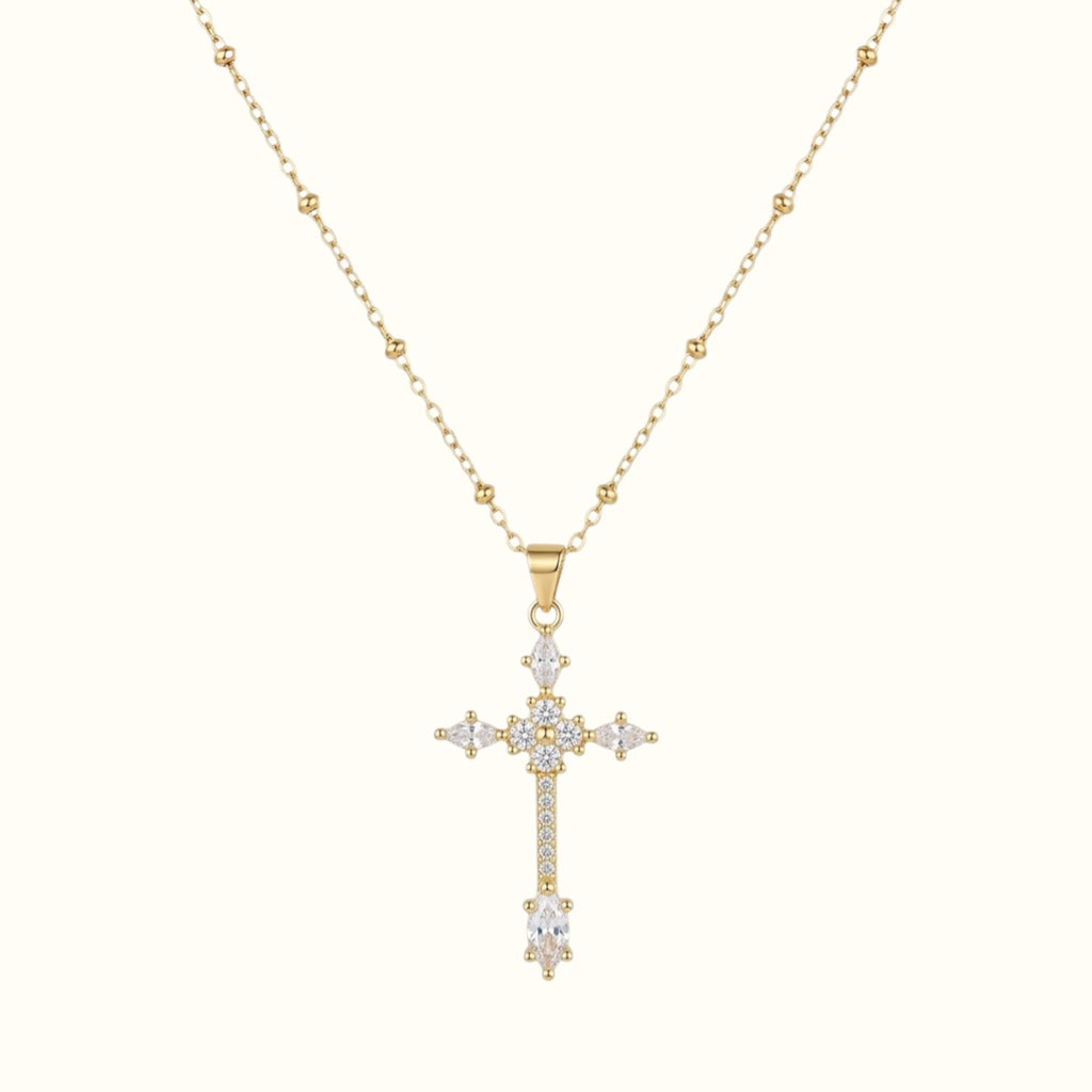 DUGO gold cross pendant necklace featuring sparkling zirconia stones on a delicate ball chain