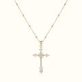DUGO gold cross pendant necklace featuring sparkling zirconia stones on a delicate ball chain