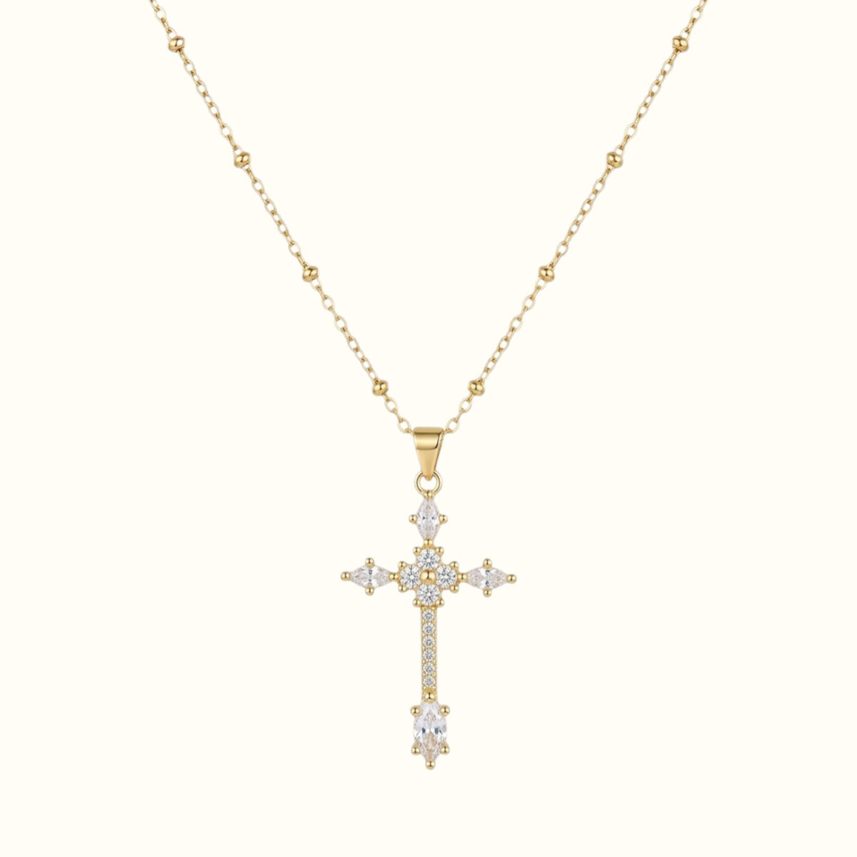 DUGO gold cross pendant necklace featuring sparkling zirconia stones on a delicate ball chain