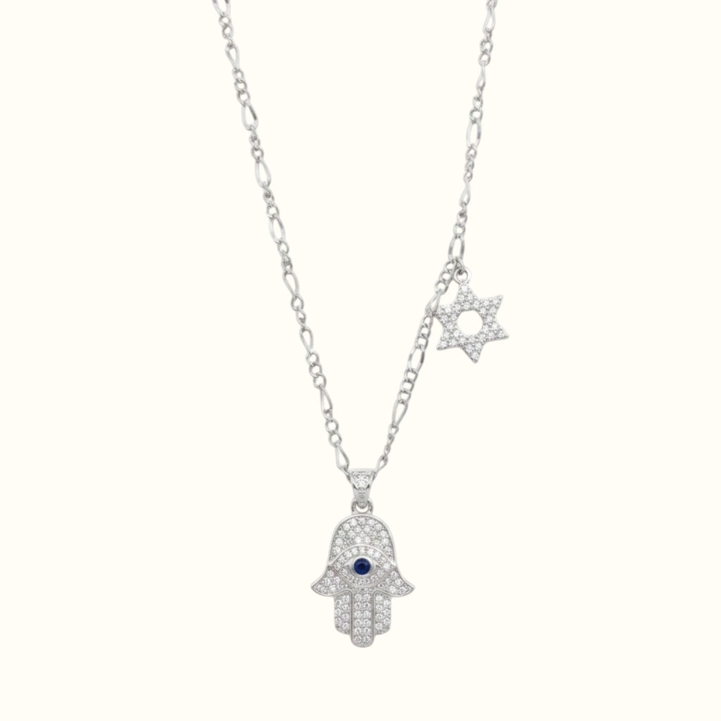 DUGO silver-tone Hamsa hand necklace with a blue evil eye, crystal accents, and a Star of David charm on a chain.