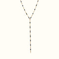 DUGO lariat necklace featuring a delicate gold chain accented with small black beads in a Y-shape design.