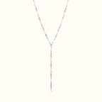 DUGO Lariat Lip Colors chain necklace featuring silver-tone links accented with small white enamel oval beads.
