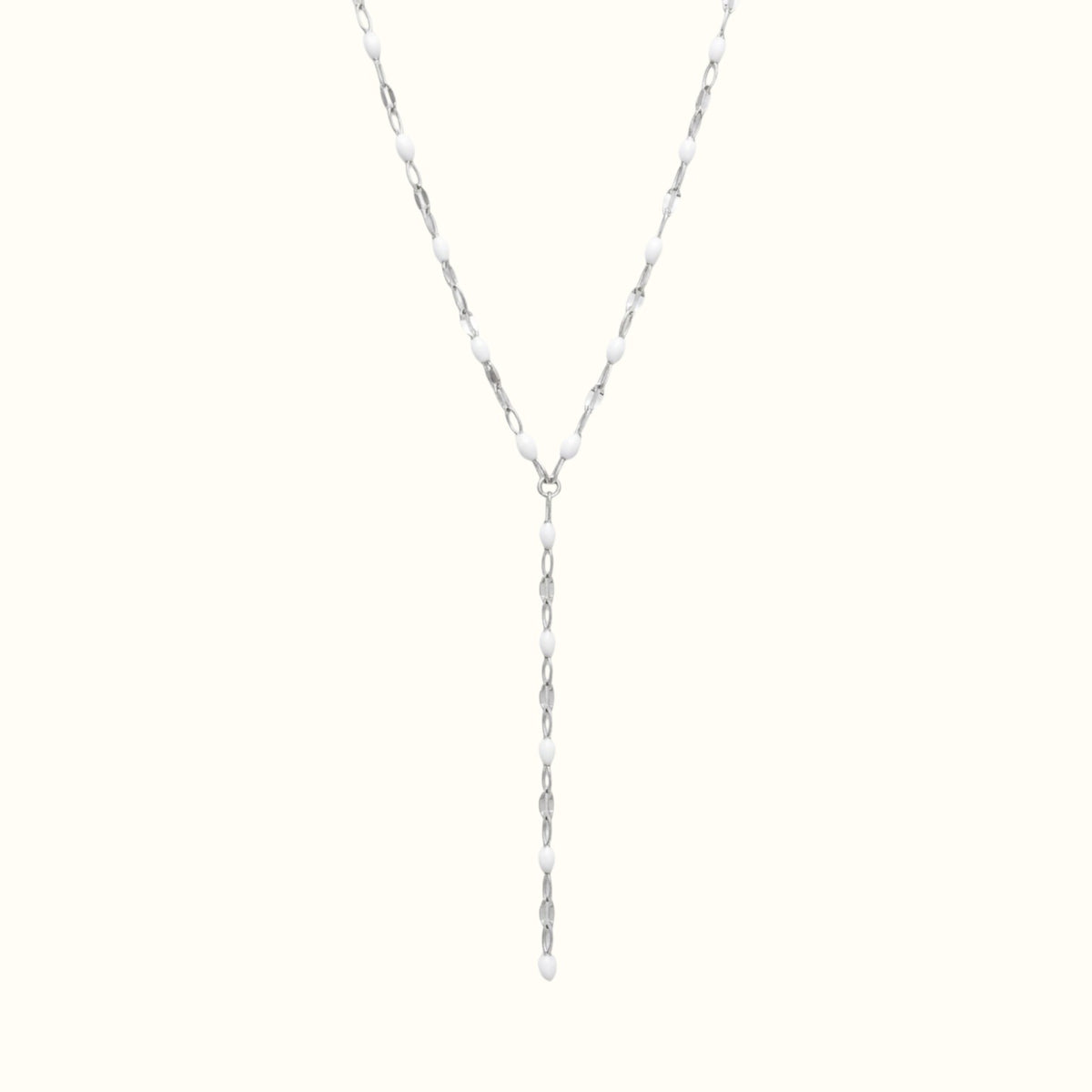 DUGO Lariat Lip Colors chain necklace featuring silver-tone links accented with small white enamel oval beads.