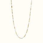 DUGO Lip Colors Chain necklace featuring gold-filled links accented with dainty white enamel beads
