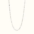 DUGO Lip Colors Chain necklace featuring white enamel beads on a polished silver stainless steel chain.