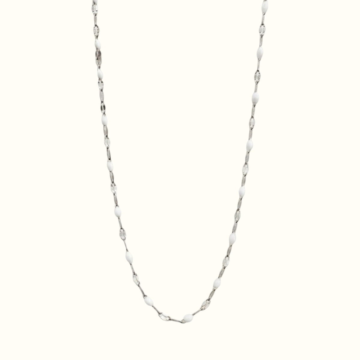 DUGO Lip Colors Chain necklace featuring white enamel beads on a polished silver stainless steel chain.