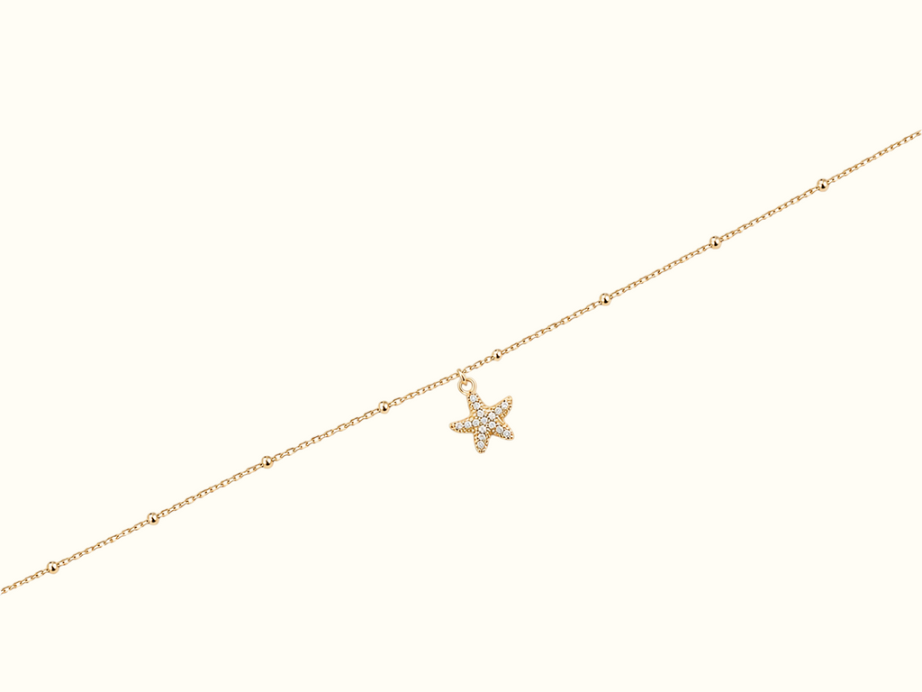 DUGO gold beaded chain anklet featuring a sparkling pavé starfish charm, crafted from 18K gold PVD stainless steel.