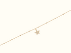DUGO gold beaded chain anklet featuring a sparkling pavé starfish charm, crafted from 18K gold PVD stainless steel.