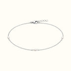 DUGO Pearl Trio Bracelet featuring three delicate freshwater-style pearls on a fine silver-tone stainless steel chain.