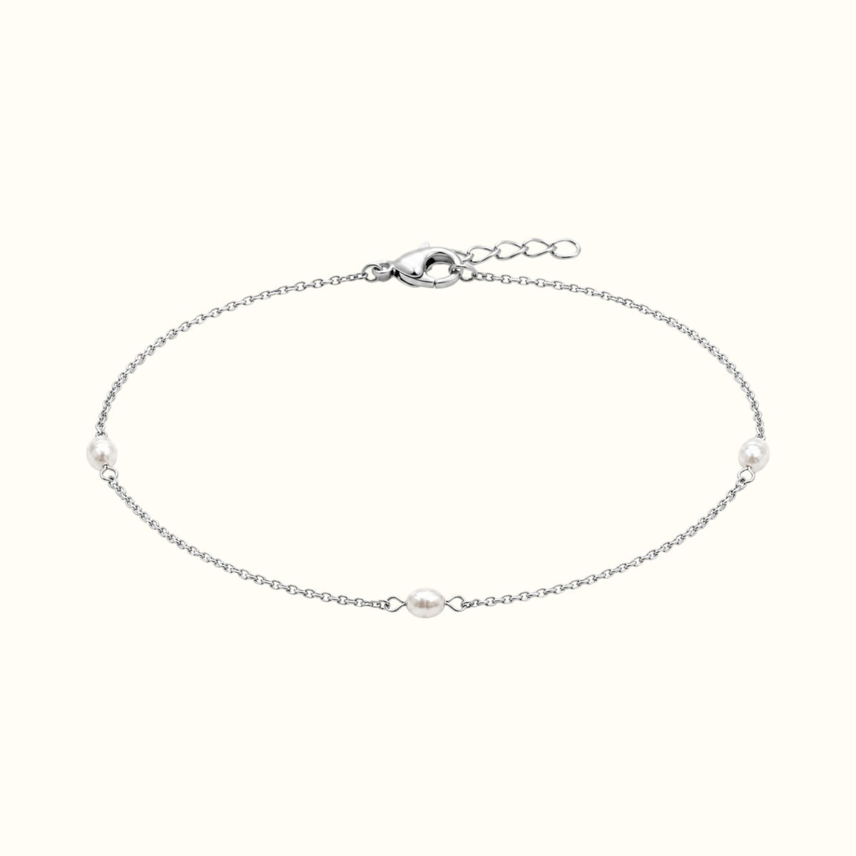 DUGO Pearl Trio Bracelet featuring three delicate freshwater-style pearls on a fine silver-tone stainless steel chain.