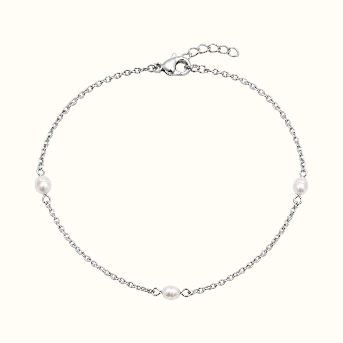DUGO Pearl Trio Bracelet featuring three freshwater-style pearls on a delicate silver-tone stainless steel chain.