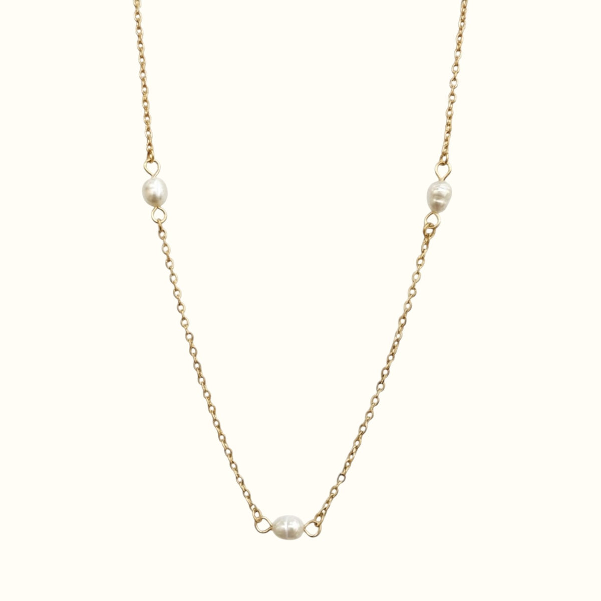 DUGO Pearl Trio necklace featuring three delicate white pearls on a fine 18K gold filled stainless steel chain