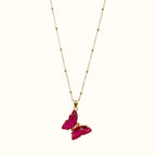 DUGO Butterfly Lover necklace featuring a vibrant pink crystal butterfly pendant on a delicate gold beaded chain