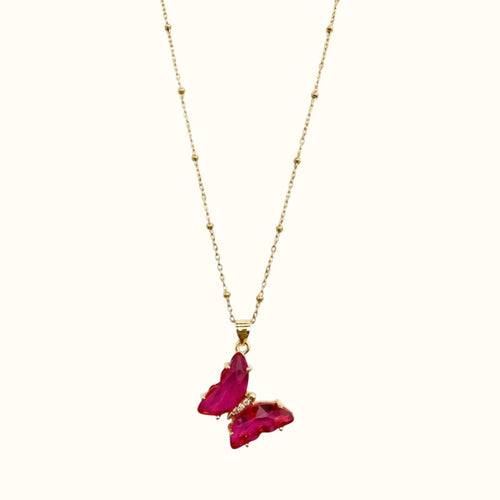 DUGO Butterfly Lover necklace featuring a vibrant pink crystal butterfly pendant on a delicate gold beaded chain