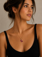 Close-up of the DUGO pink Butterfly Lover Necklace worn on the neck