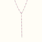 DUGO lariat style necklace featuring silver chain links accented with vibrant pink enamel lip-shaped charms