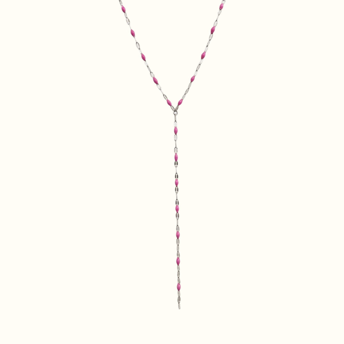 DUGO lariat style necklace featuring silver chain links accented with vibrant pink enamel lip-shaped charms