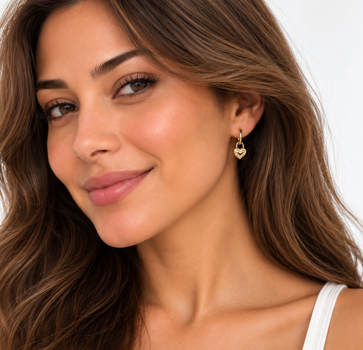 DUGO gold Puffy Heart Hoop Earring worn by a model