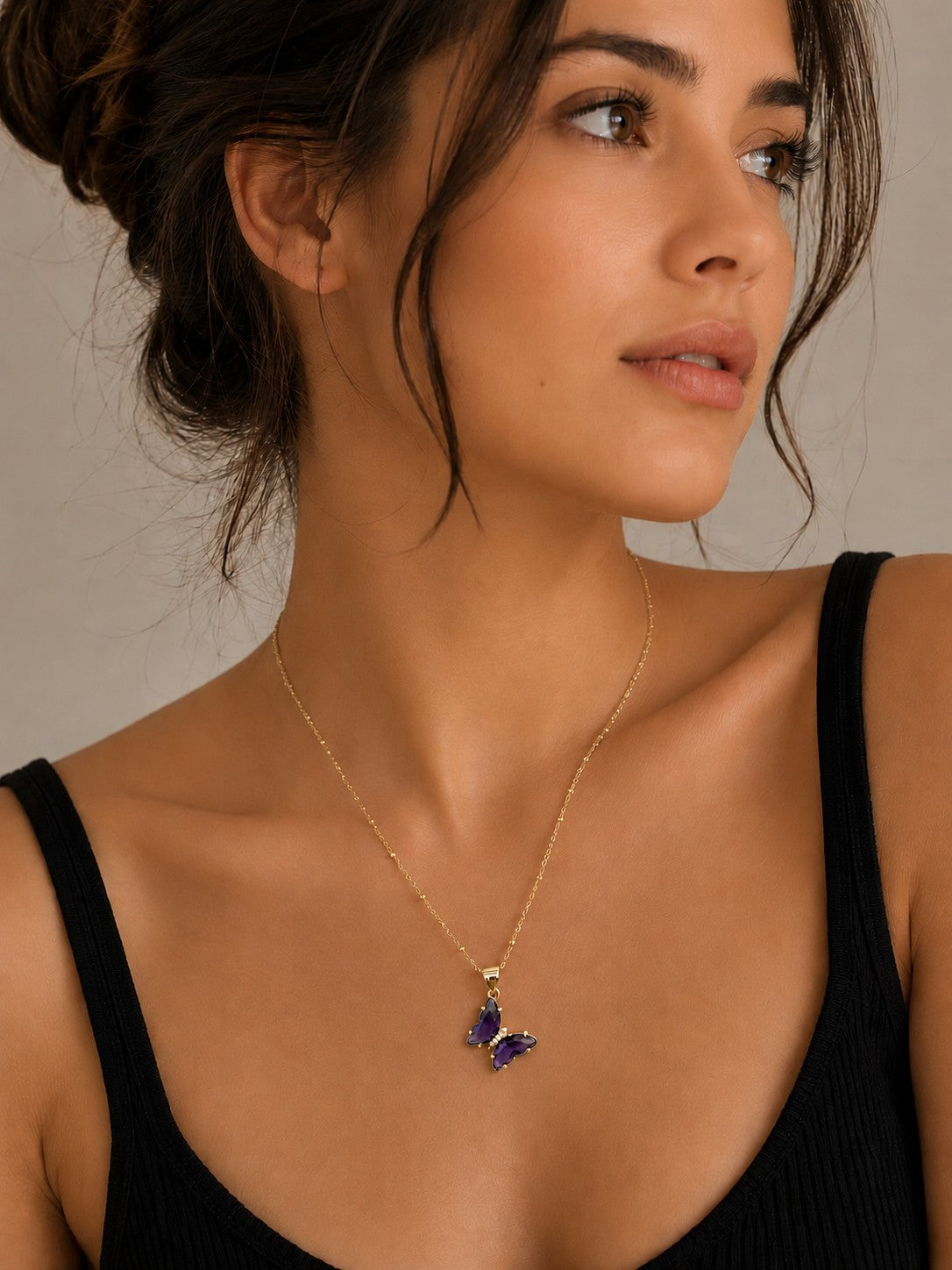 Close-up of the DUGO purple Butterfly Lover Necklace worn on the neck