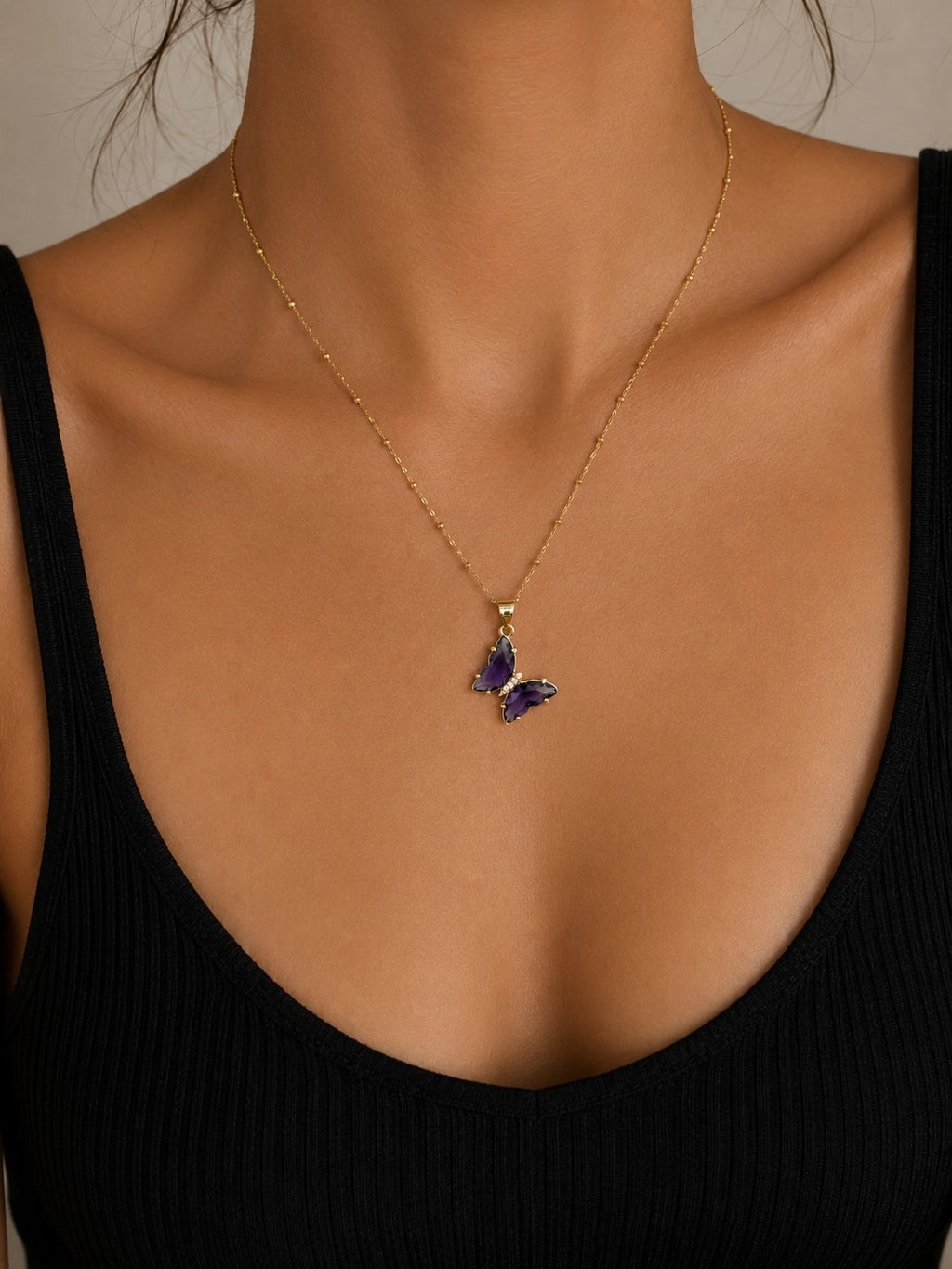 Woman wearing the DUGO purple Butterfly Lover Necklace